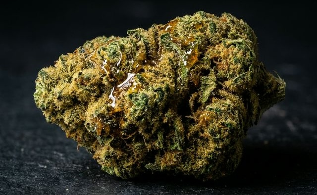 Close up of a cannabis moon rock covered in kief